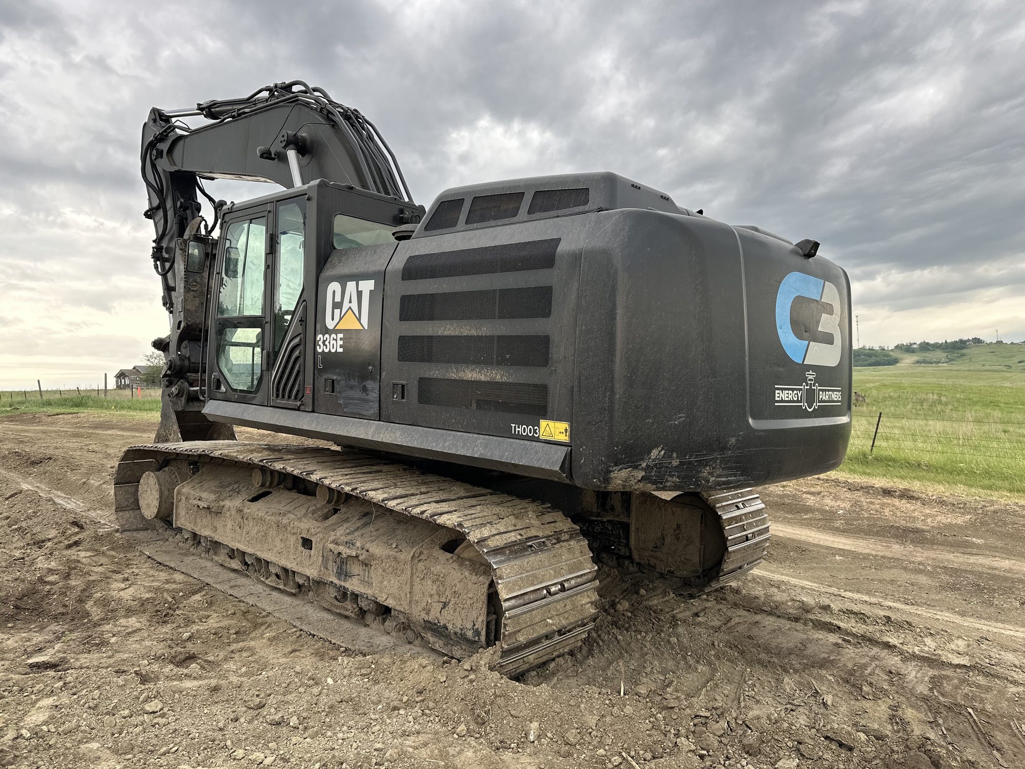 C3 excavator on a dirt pad