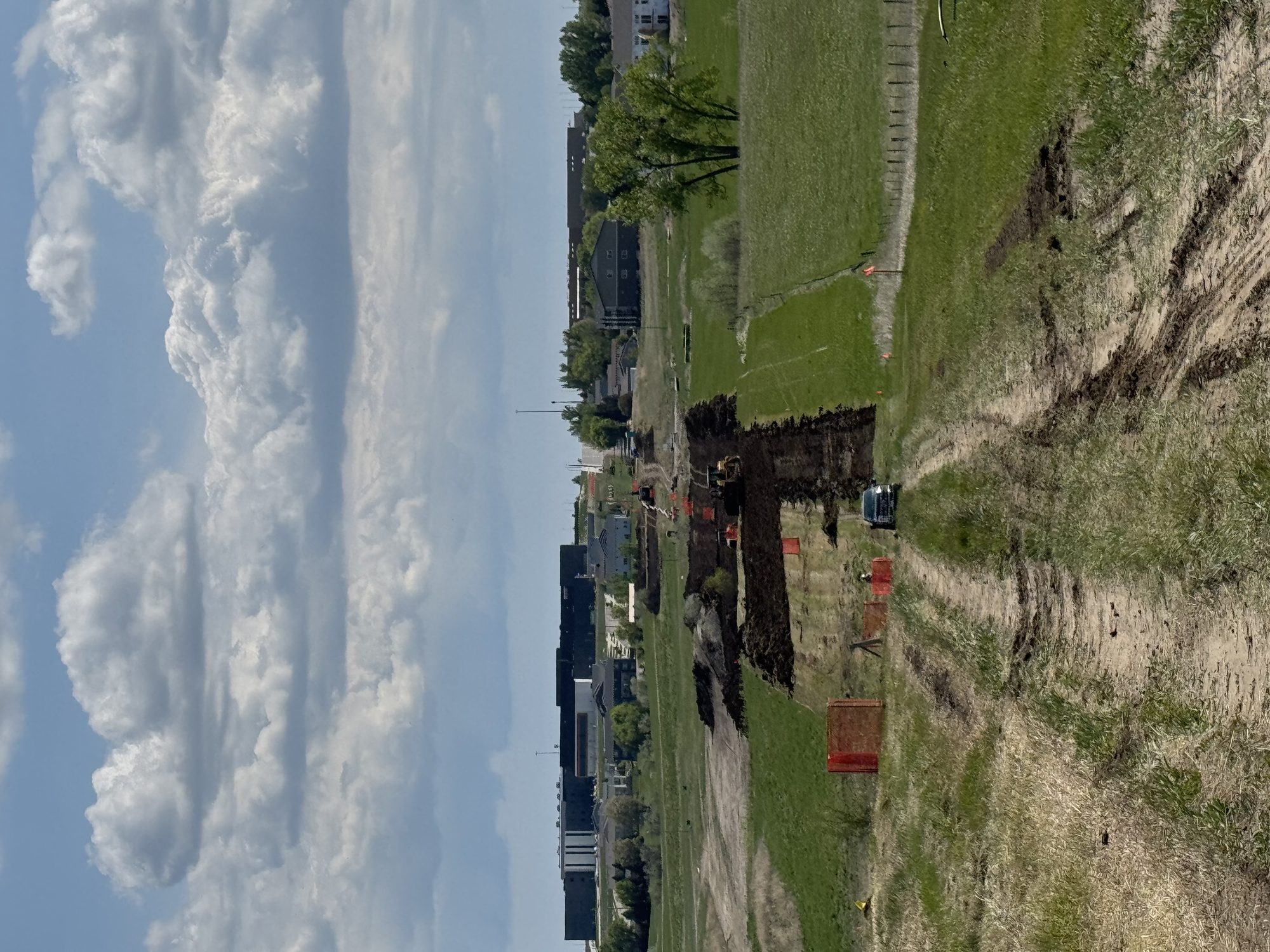 Topsoil stockpile and work area on open ground