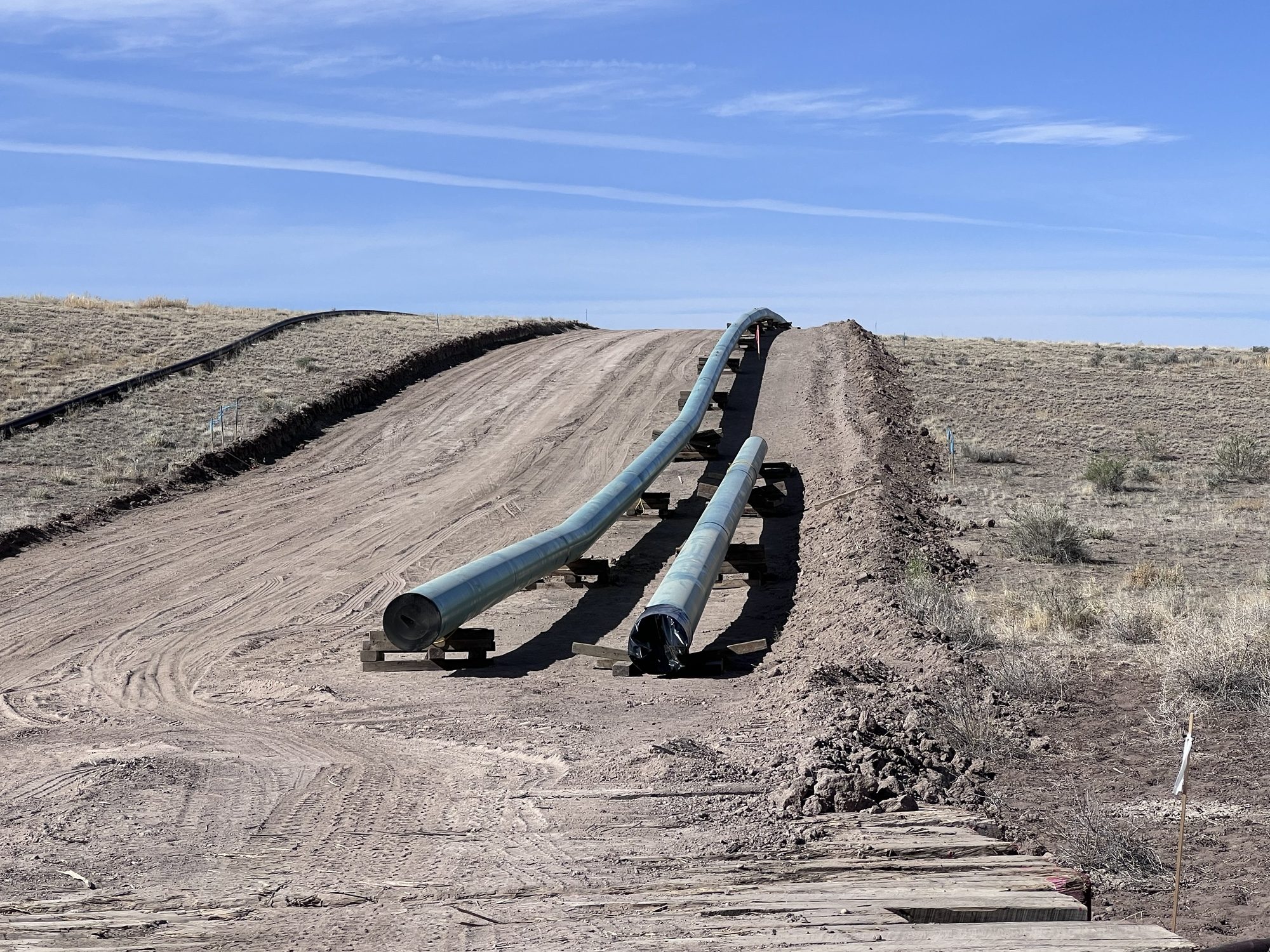 Coated pipe on skids along the right-of-way